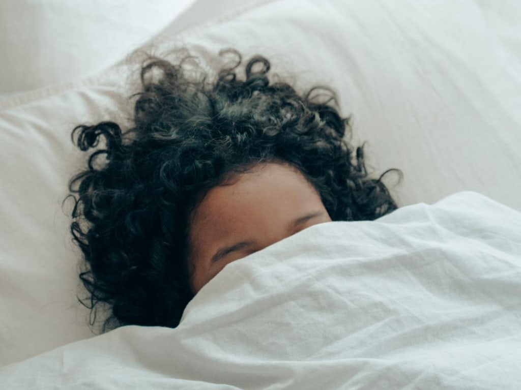 Mum hiding under a white duvet